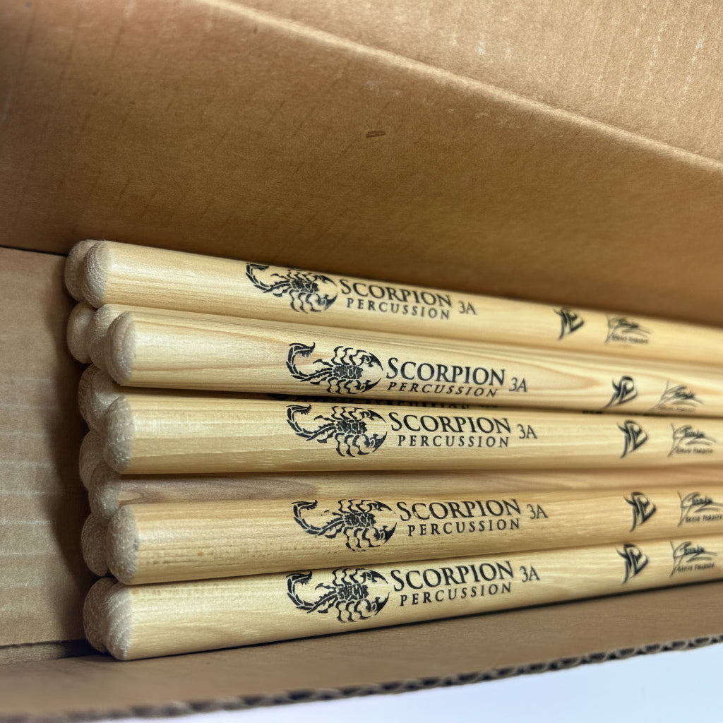 Set of Scorpion Percussion drumsticks in a cardboard box
