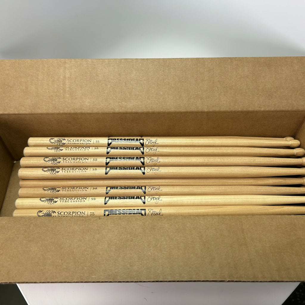 Box of drumsticks with visible brand name on a white background
