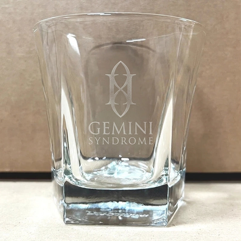 Glass cup with the words 'Gemini Syndrome' etched on the front.