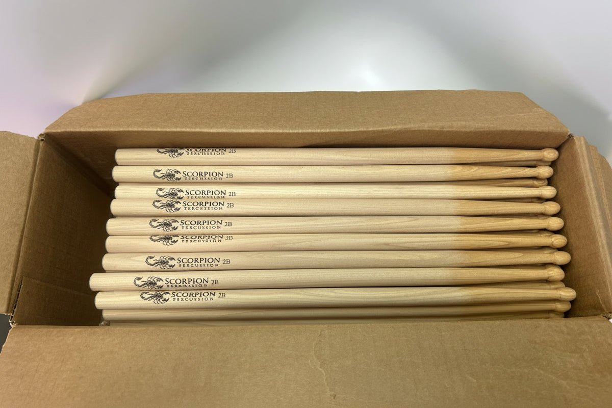 Box of drumsticks with 'Scorpion' branding on a white background